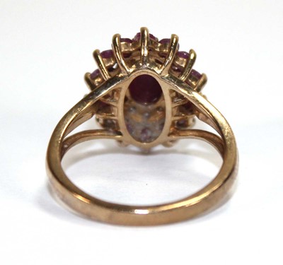 Lot 588 - A 9ct yellow gold cluster ring set three tiers...