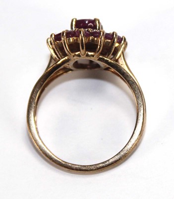 Lot 588 - A 9ct yellow gold cluster ring set three tiers...