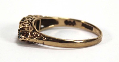 Lot 589 - A 9ct yellow gold ring set three graduated...