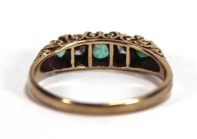 Lot 589 - A 9ct yellow gold ring set three graduated...