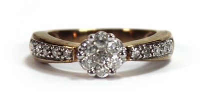 Lot 590 - A 9ct yellow gold cluster ring set seven small...