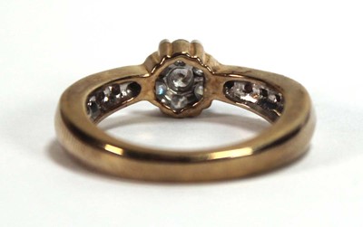 Lot 590 - A 9ct yellow gold cluster ring set seven small...