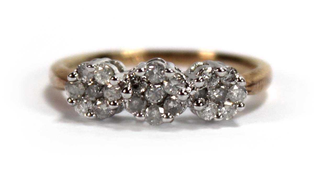 Lot 591 - A 9ct yellow gold ring set small diamonds in a...
