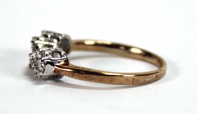 Lot 591 - A 9ct yellow gold ring set small diamonds in a...