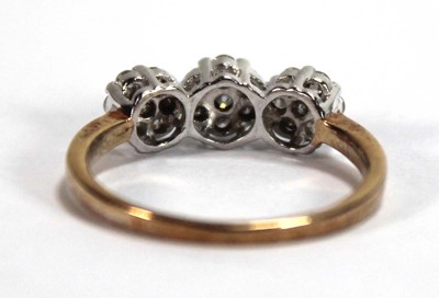 Lot 591 - A 9ct yellow gold ring set small diamonds in a...
