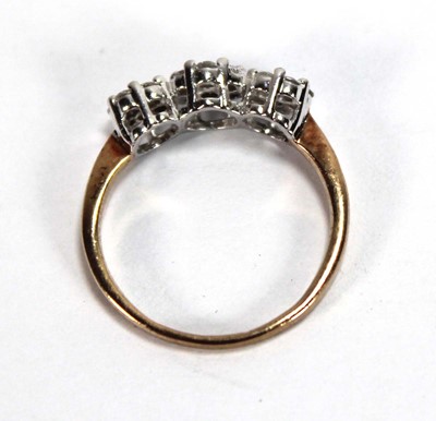 Lot 591 - A 9ct yellow gold ring set small diamonds in a...
