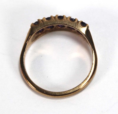Lot 592 - A 9ct yellow gold ring set five oval amethyst,...