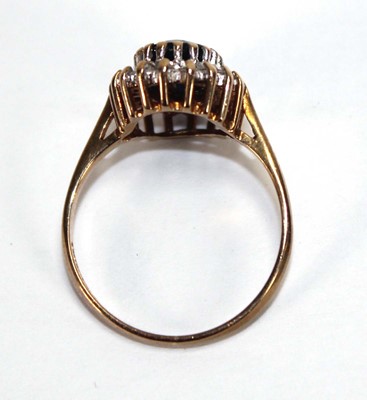 Lot 593 - A 9ct yellow gold sapphire and diamond cluster...