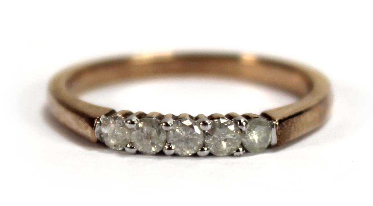 Lot 594 - A 9ct yellow gold ring set five small diamonds...