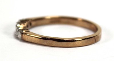 Lot 594 - A 9ct yellow gold ring set five small diamonds...