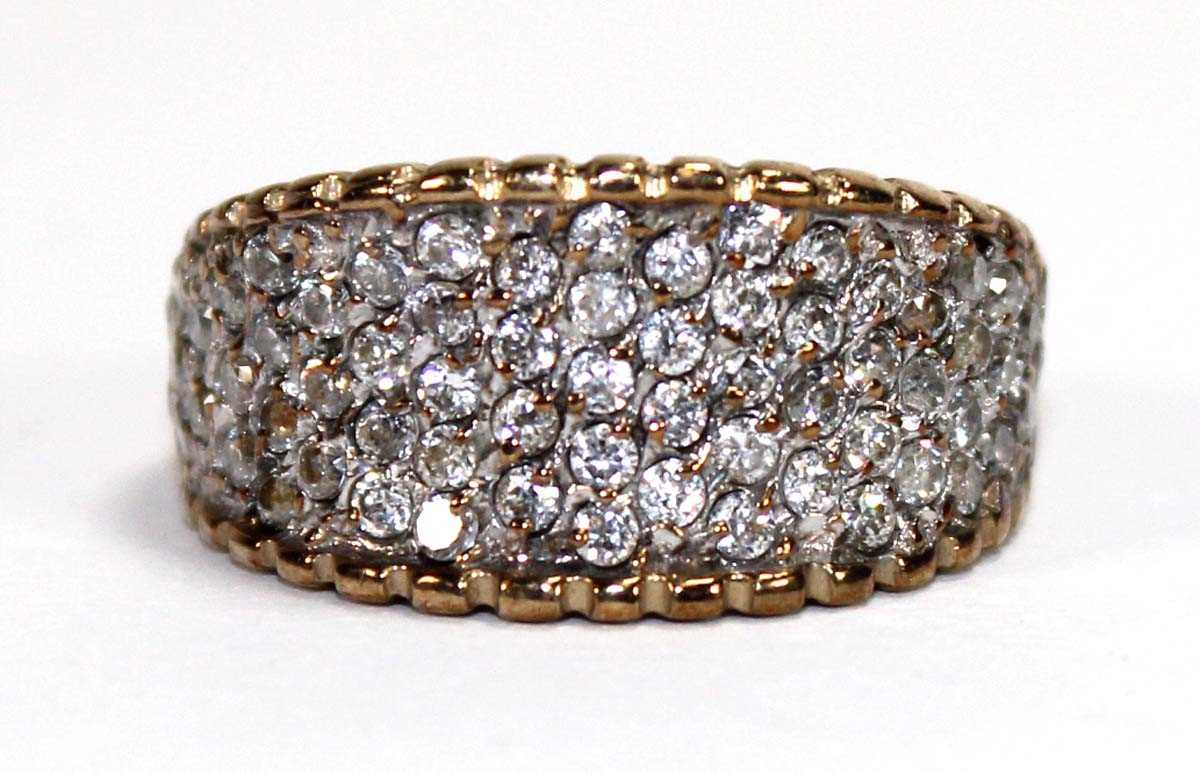 Lot 597 - A 9ct yellow gold ring pave set paste,...