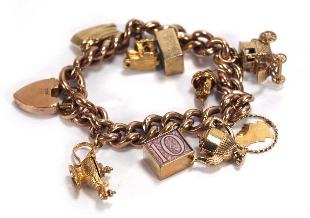 Lot 598 - A 9ct rose gold hollow curblink bracelet with...