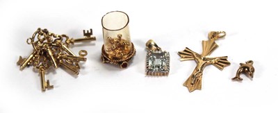 Lot 601 - Five 9ct yellow gold and yellow metal charms...