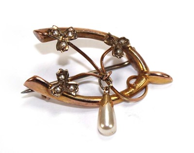 Lot 607 - An early 20th century 9ct yellow gold wishbone...