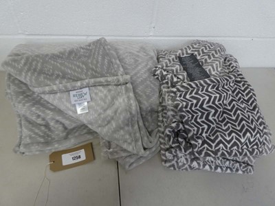Lot 1258 - x2 grey patterned throws by Monte & Jardin &...