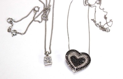 Lot 616 - A 9ct white gold pendant necklace of heart...