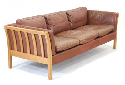 Lot 5 - A Danish brown leather upholstered three...