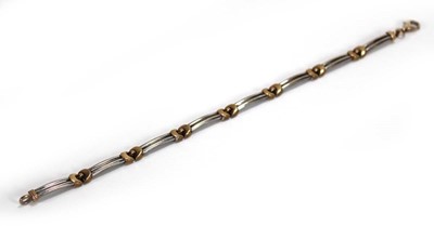 Lot 621 - A 9ct two-colour gold elongated link bracelet,...