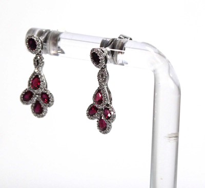 Lot 623 - A pair of 18ct white gold ear pendants, each...