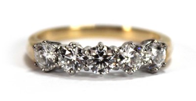 Lot 624 - An 18ct yellow gold ring set five brilliant...