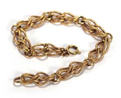Lot 629 - A yellow metal double row textured link...