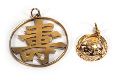 Lot 632 - A Chinese Export yellow metal pendant with...