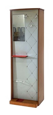 Lot 148 - A 1970's teak hall stand, the vinyl clad front...