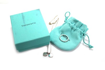 Lot 638 - A Tiffany & Co. silver heart shaped pendant...