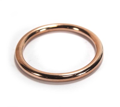 Lot 648 - A9ct rose gold hollow slave bangle, internal d....