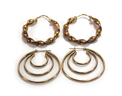 Lot 652 - Two pairs of 9ct yellow gold hoop earrings, l....