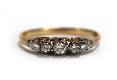 Lot 658 - A 18ct yellow gold ring set three small...