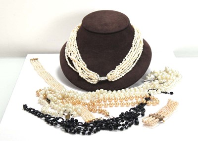 Lot 667 - A nine strand freshwater pearl necklace with...