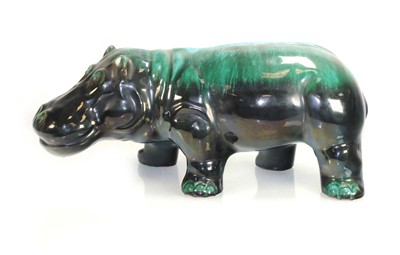 Lot 274 - A Canadian pottery figure modelled as a hippo,...