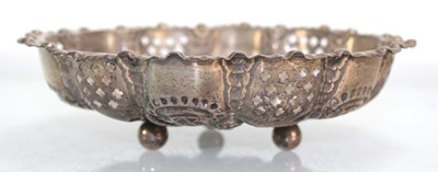 Lot 302 - An Edwardian stamped silver dish of circular...