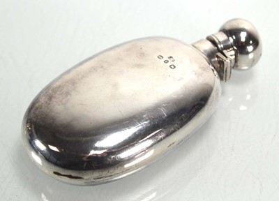 Lot 306 - A Victorian silver hip flask of cushioned oval...