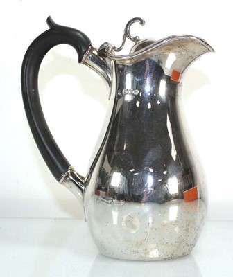 Lot 331 - A Victorian silver hot water jug of ovoid form,...