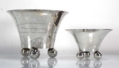 Lot 335 - A graduated pair of Swedish hammered silver...