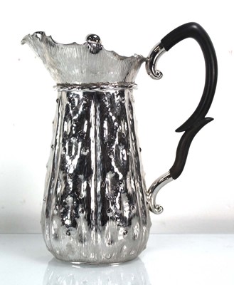 Lot 351 - A silver plated two pint jug of naturalistic...