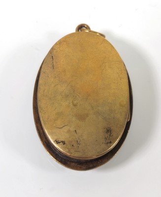 Lot 404 - A 19th century yellow metal and enamel locket...