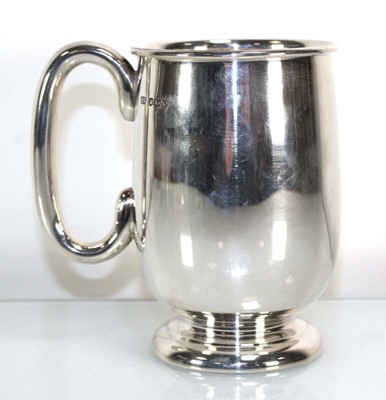 Lot 353 - A silver tankard of plain bulbous form, Viners,...