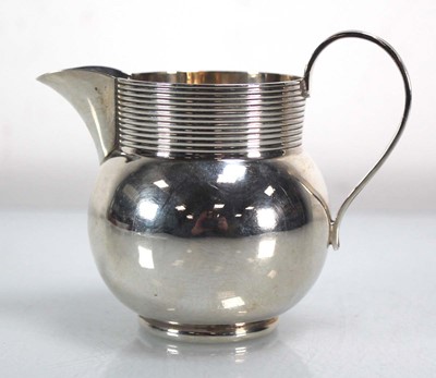 Lot 356 - An early 20th century silver cream jug of...