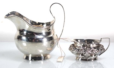Lot 357 - A George III silver cream jug, maker CE,...