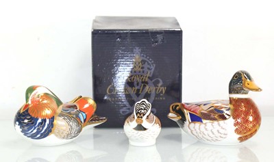 Lot 202 - Three Royal Crown Derby paperweights modelled...