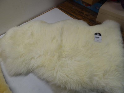 Lot 3599 - Sit on sheep skin rug