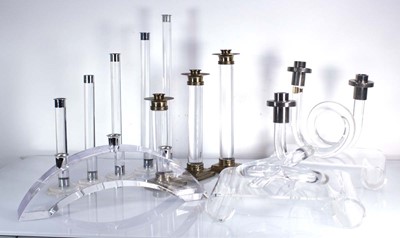 Lot 383 - A near pair of curled lucite candlesticks in...