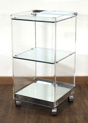 Lot 384 - A lucite three-tier trolley with chromed...
