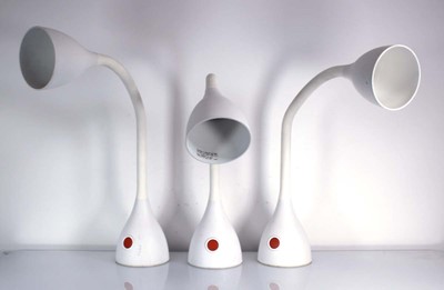 Lot 390 - A set of three white gooseneck table lamps by...