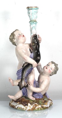 Lot 256 - A Meissen style figural candlestick modelled...