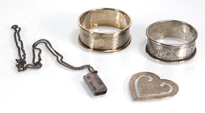 Lot 386 - A silver bookmark of heart shaped form, maker...