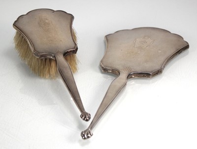 Lot 389 - A silver backed engine turned hand mirror and...